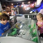 children building models in glove box