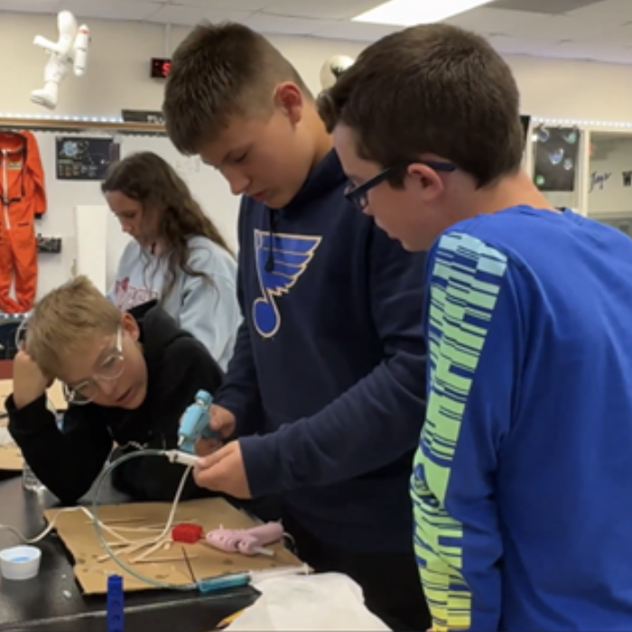 Kids working kids working on science project