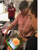 Raytheon employee with Merge Cubes